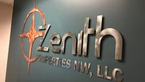 Zenith Properties lobby sign made from reclaimed metal